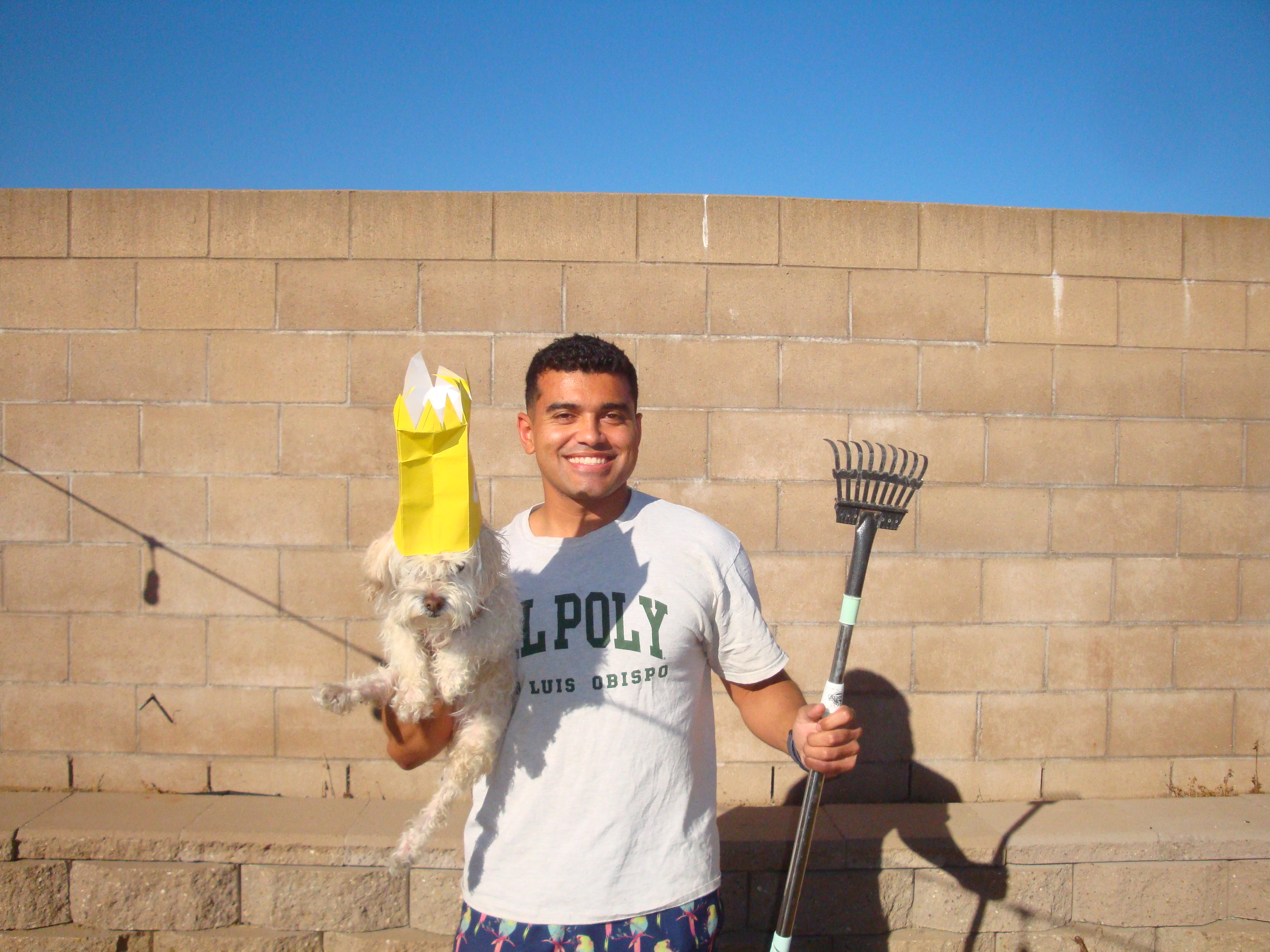 Pet waste removal technician cleaning a residential yard in San Luis Obispo County